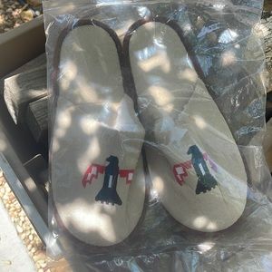 Brand new sealed in plastic slippers